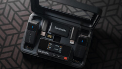 Saramonic wireless microphone system with receiver, transmitter, and accessories displayed in open carrying case.