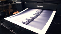 Canon printer outputting a black and white contact sheet of film negatives.