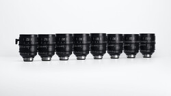 Eight cinema prime lenses arranged in a row, displaying focal lengths from 14mm to 85mm.