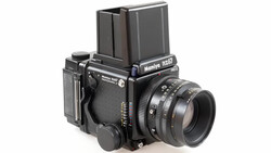 Mamiya RB67 medium format film camera with prism viewfinder and standard lens mounted.