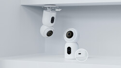 Product shot of white compact surveillance cameras mounted on white shelving, showing 360-degree rotation capability.