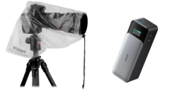 Camera rain cover on tripod and portable power bank side by side.