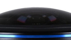 Close-up of a camera's viewfinder display showing a dark interior with blue accent lighting along the frame edge.