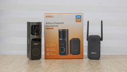 Imou battery-powered doorbell kit with camera, chime, and Wi-Fi extender displayed with packaging.