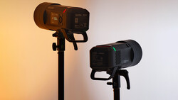 Two professional LED studio lights mounted on stands with warm and cool color temperatures.