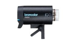 Broncolor Stelos monolight with power switch and modeling light mounted on stand.