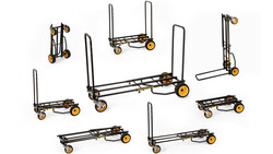Collection of folding hand trucks and dollies in various sizes arranged on a white background.