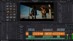 Screenshot of video editing software showing a scene with two people on a rooftop and a timeline with color-coded audio and video tracks.