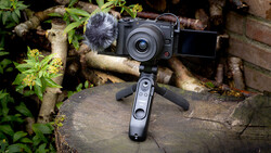 Canon mirrorless camera with articulating screen mounted on a gimbal stabilizer with wireless remote control.