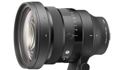 Professional camera lens with optical elements visible through front glass, mounted on a black support base against white background.