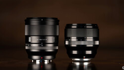 Two camera lenses side by side against a brown background, the left lens noticeably larger than the right.