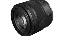 Black telephoto lens with focus ring and depth-of-field markings visible on the barrel.