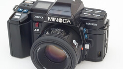 Three Minolta film cameras displayed side by side against a white background.