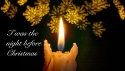 Lit candle with golden snowflake overlays and 'Twas the night before Christmas' text on dark background.