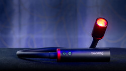 SmallRig handheld light with illuminated red-orange head mounted on adjustable arm.