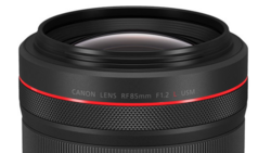Canon RF 85mm F1.2L USM lens with red accent ring and textured grip band.