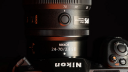 Nikkor 24-70/2.8 S II lens mounted on a camera body, showing the zoom ring and focal length markings.