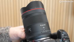 Canon RF 14mm f/1.4L USM lens held in hand during product demonstration.
