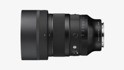 Black telephoto lens with extended barrel and focus ring, shown in profile against neutral background.