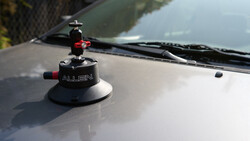 Allen suction cup camera mount mounted on vehicle hood with ball head