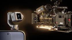 Professional cinema camera rig with mounted lens and accessory arm beside a compact smartphone gimbal stabilizer.