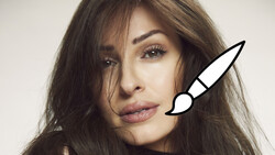 Portrait of woman with long dark hair and illustrated paintbrush overlay