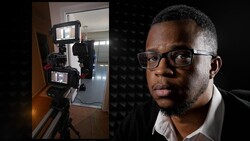Two-camera rig mounted on tripod with monitors, positioned in an interior space; portrait of man wearing glasses on right.