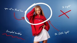 Woman in red jacket posing against blue background with circular light and annotated lighting diagram.