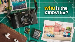 Flat lay of a vintage film camera, printed photographs, memory cards, earbuds, and brown leather pouch on a green cutting mat.