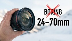 Hand holding a 24-70mm zoom lens against a snowy mountain backdrop with a red X symbol and text reading 'BORING' overlaid.