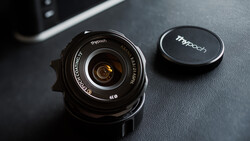 Tthpooh wide-angle lens with front cap on dark textured surface