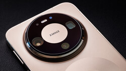 Circular camera module on white smartphone with multiple lenses arranged around center branding.