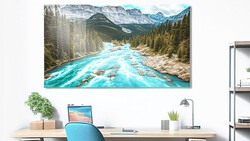Turquoise river flowing through forested valley with snow-capped mountains in background.