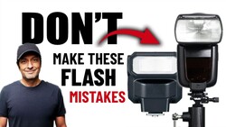 Instructor in casual attire pointing to three external camera flash units displayed against white background.