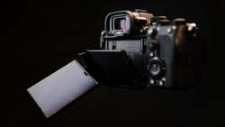 Sony mirrorless camera with articulating touchscreen display tilted outward against black background