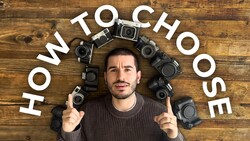 Man in gray sweater surrounded by vintage film cameras arranged in a circle, with "HOW TO CHOOSE" text arced above