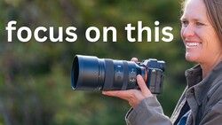 Photographer holding a telephoto lens with text overlay reading "focus on this"