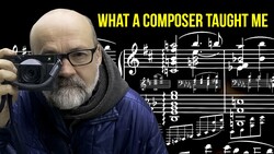 Man with camera holding sheet music, with text overlay reading 'WHAT A COMPOSER TAUGHT ME'