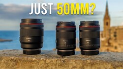 Three Canon RF-mount lenses displayed on a stone wall with Mediterranean coastline and church tower in background
