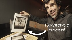 Photographer holding a vintage print or negative showing a 130-year-old photographic process