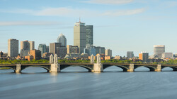 Boston skyline and Longfellow Bridge spanning the Charles River at golden hour