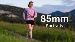 Female runner in purple long-sleeve shirt jogging through grassy meadow with forested mountains in background at dusk