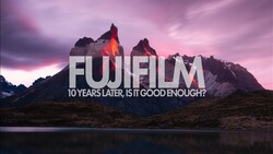Graphic overlay with 'FUJIFILM' text and tagline on dramatic mountain landscape at sunset