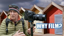 Filmmaker holding cinema camera with beach huts in background, with 'WHY FILM?' text overlay