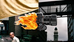 Camera with flame effect composite overlay during urban location shoot