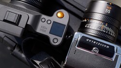 Overhead view of vintage rangefinder camera with lens and accessory shoe mounted controller