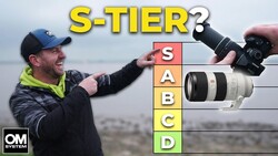 Photographer holding Sony camera demonstrating S-tier lens ranking graphic