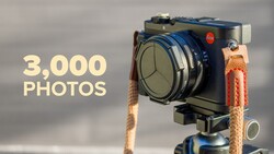 Large format camera mounted on tripod with text overlay reading '3,000 PHOTOS'