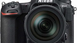 Nikon D500 DSLR camera with 18-140mm kit lens on white background