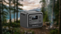 Bluetti portable power station displayed in forest landscape setting